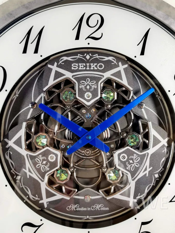 Seiko QXM397SRH “Winter King” Melodies in Motion Dancing Dial Musical Wall Clock with 36 Songs