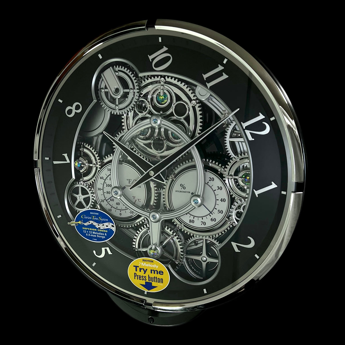 Rhythm “Chronograph (Black/Silver)” Skeletonized Dial Magic Motion Musical Wall Clock with Moving Gears - 4MH442WU08