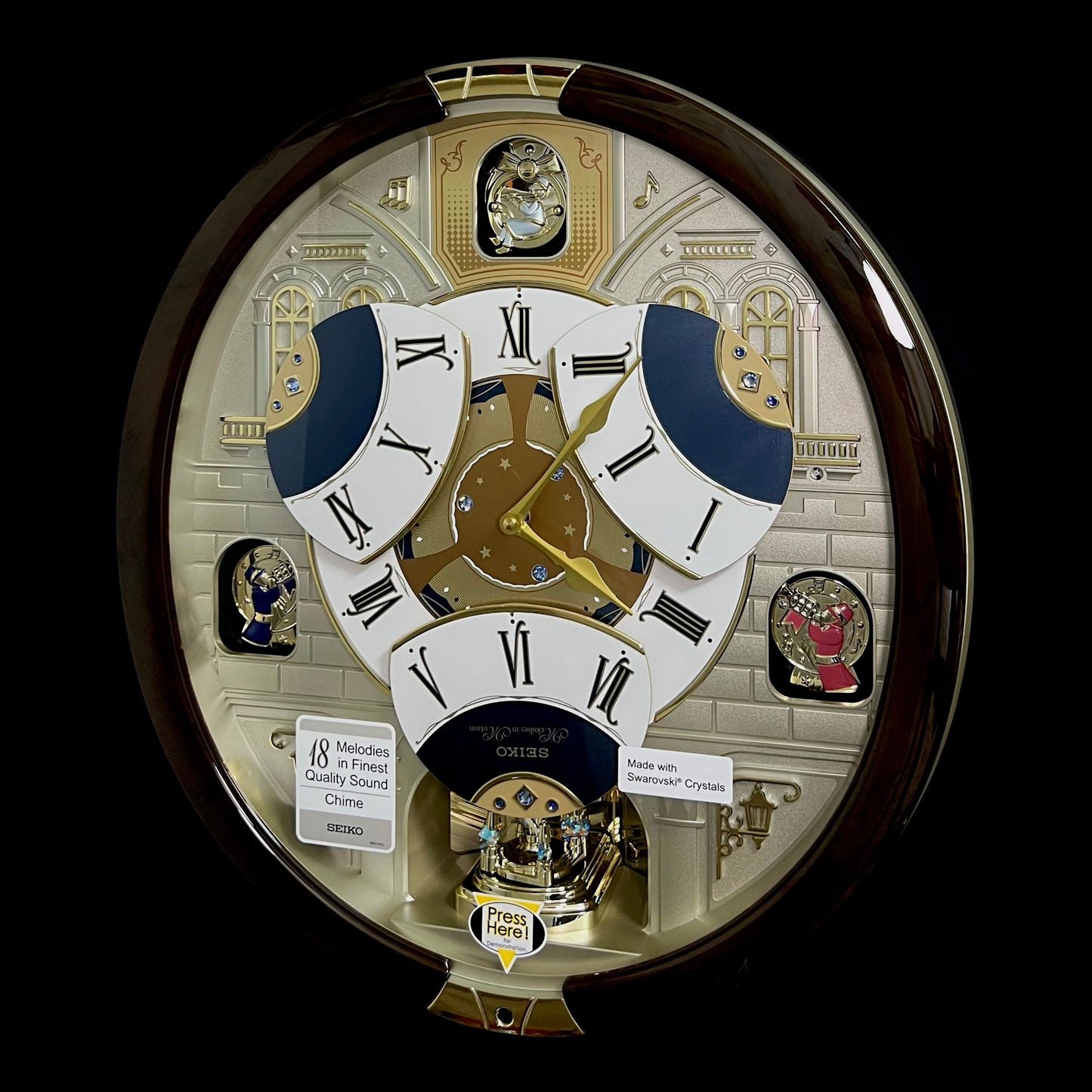 Seiko QXM371BRH “Castle Windows” Melodies in Motion Dancing Dial Musical Wall Clock