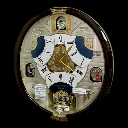 Seiko QXM371BRH “Castle Windows” Melodies in Motion Dancing Dial Musical Wall Clock