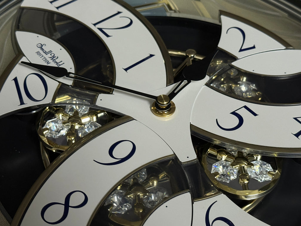 Rhythm "Classic Brilliance" Moving Dial Magic Motion Musical Wall Clock - 4MH787PD18