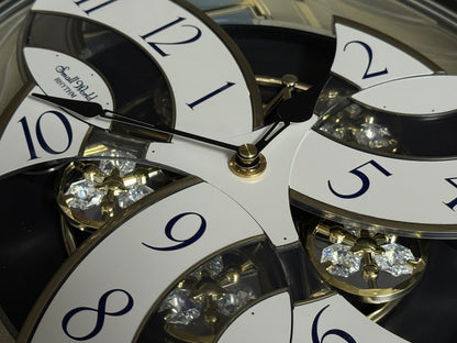 Rhythm "CTS Brilliance" Moving Dial Magic Motion Musical Wall Clock with Popular Melodies - 4MH787-R18