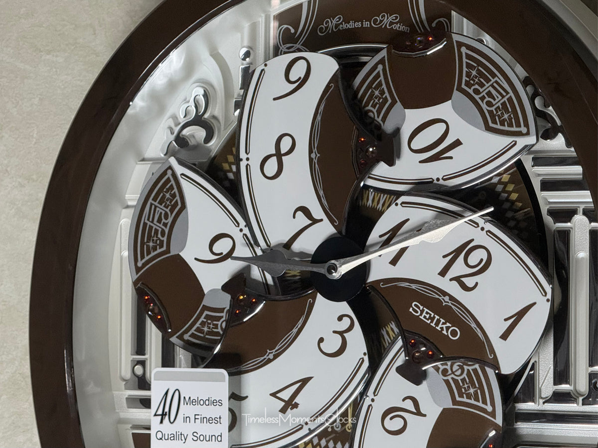 Seiko QXM615BRH “Snow Castle” Melodies in Motion Dancing Dial Musical Wall Clock with 40 Songs
