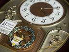 Seiko QXM357BRH “Warm Summer Stars” Melodies in Motion Musical Decorative Moving Wall Clock with 19 Songs