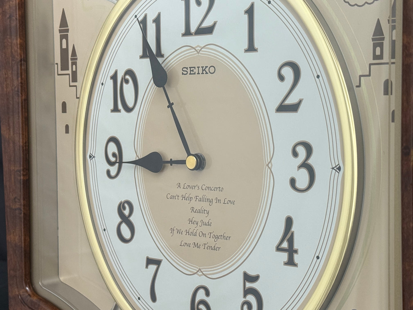 Seiko QXM135BRH "Lover’s Castle" Melodies in Motion Musical Moving Wall Clock with Popular Melodies