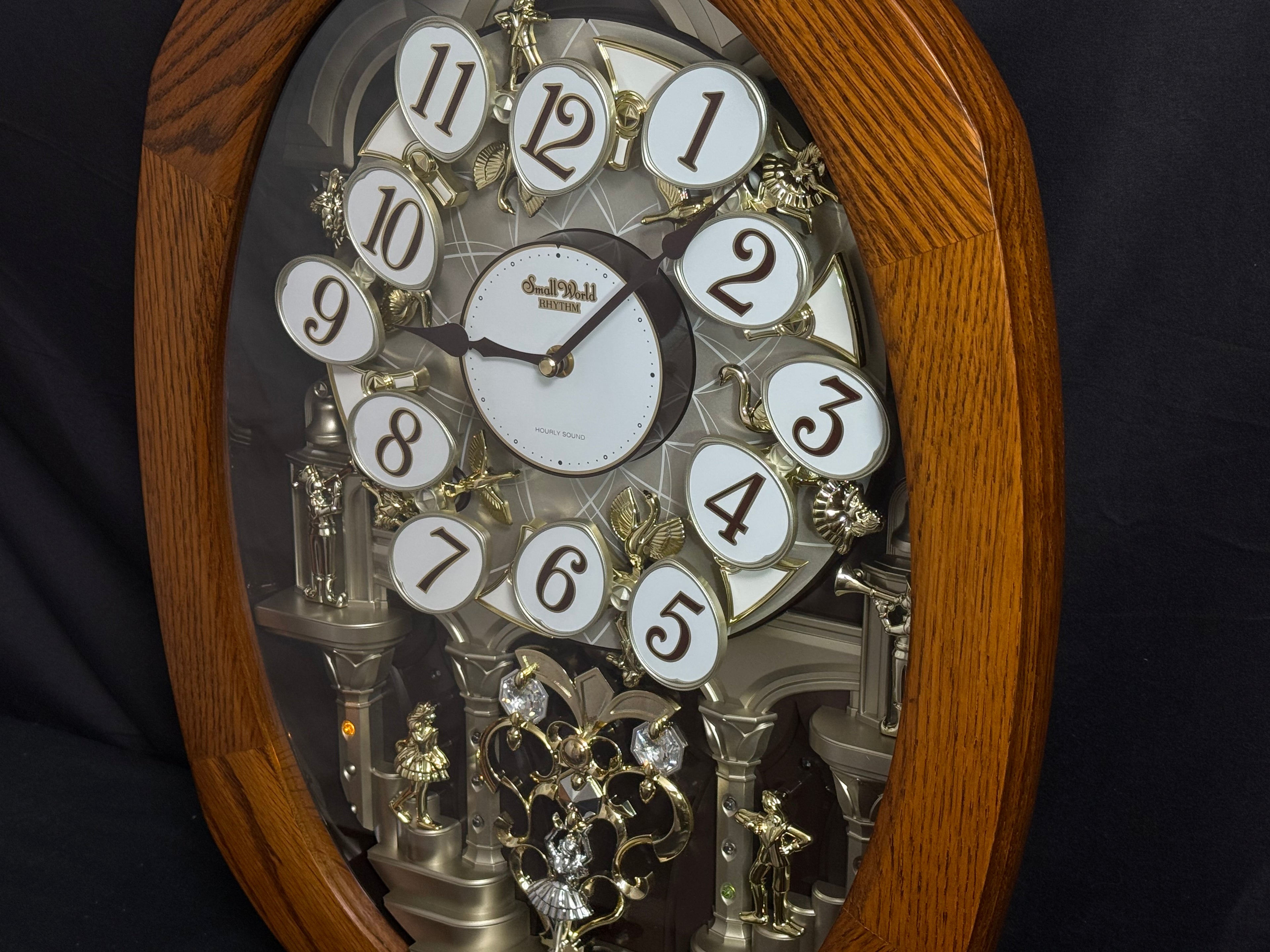 Rhythm "SSS Encore" Magic Motion Musical Wooden Wall Clock with Animated Moving Dial and Popular Melodies - 4MH810-R06