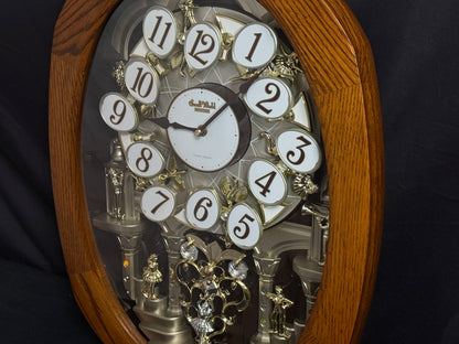 Rhythm "SSS Encore" Magic Motion Musical Wooden Wall Clock with Animated Moving Dial and Popular Melodies - 4MH810-R06