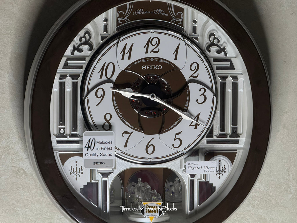 Seiko QXM615BRH “Snow Castle” Melodies in Motion Dancing Dial Musical Wall Clock with 40 Songs