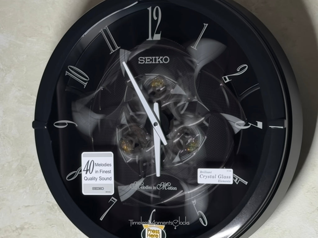 Seiko QXM621KRH “Onyx” Melodies in Motion Dancing Dial Musical Wall Clock with 40 Songs