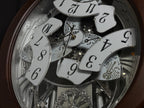 Rhythm "Anthology Espresso" Magic Motion Musical Wooden Wall Clock with Moving Dial - 4MH869WU06