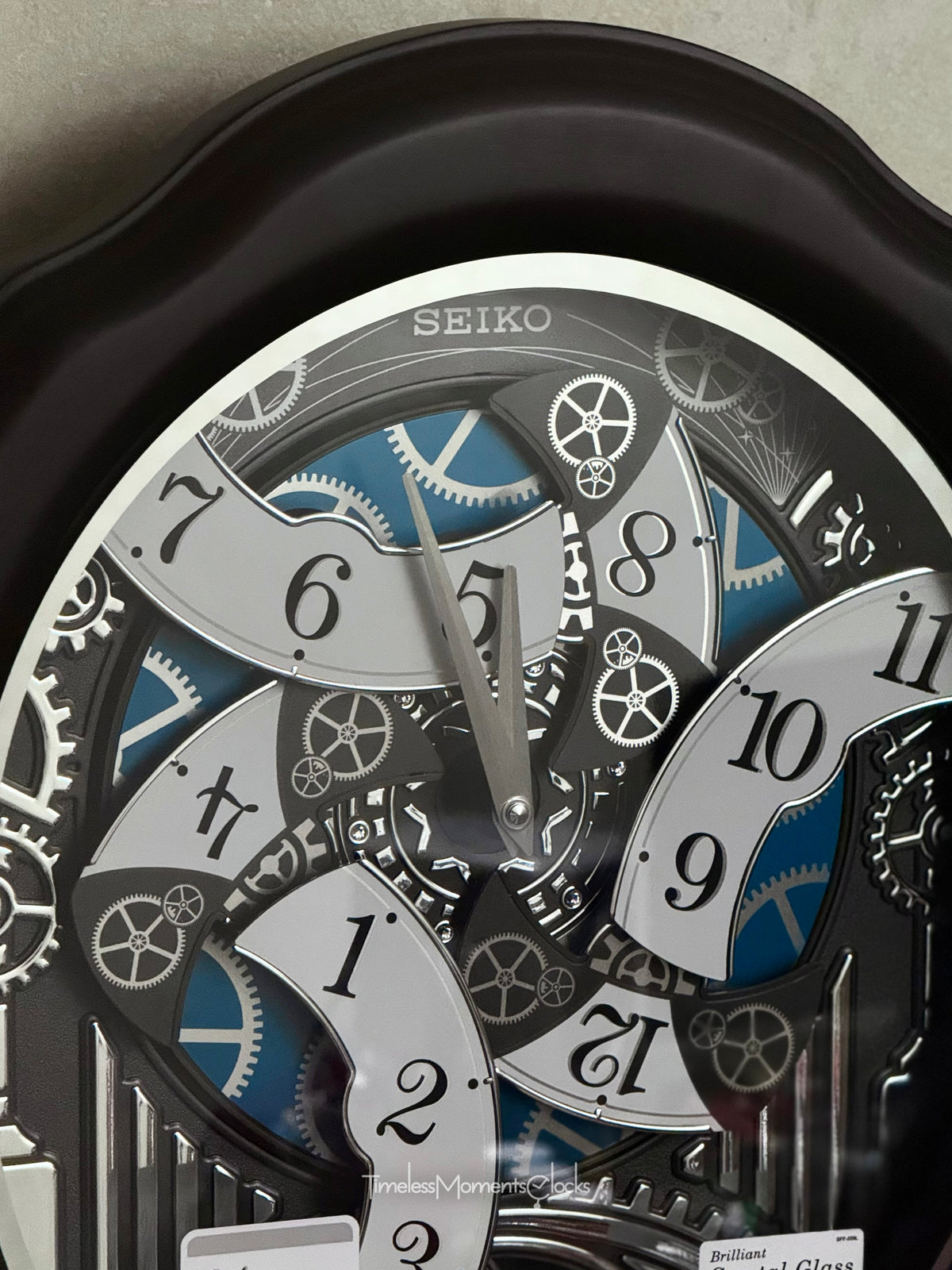 Seiko QXM609NRH “Opera” Melodies in Motion Dancing Dial Musical Wooden Wall Clock with 36 Songs