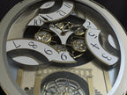 Rhythm "CTS Brilliance" Moving Dial Magic Motion Musical Wall Clock with Popular Melodies - 4MH787-R18