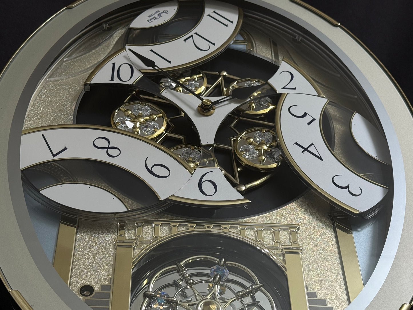 Rhythm "CTS Brilliance" Moving Dial Magic Motion Musical Wall Clock with Popular Melodies - 4MH787-R18