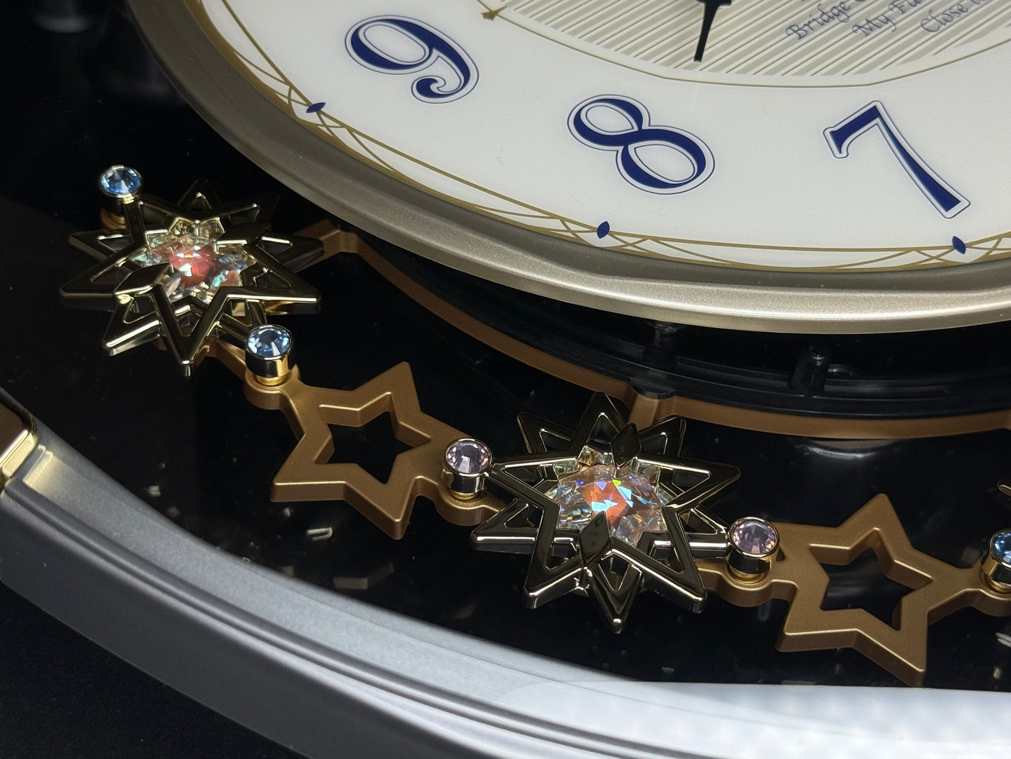 Seiko QXM155SRH "Twinkling Stars" Melodies in Motion Musical Decorative Pendulum Wall Clock with Popular Music