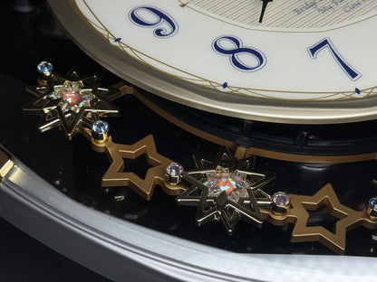 Seiko QXM155SRH "Twinkling Stars" Melodies in Motion Musical Decorative Pendulum Wall Clock with Popular Music