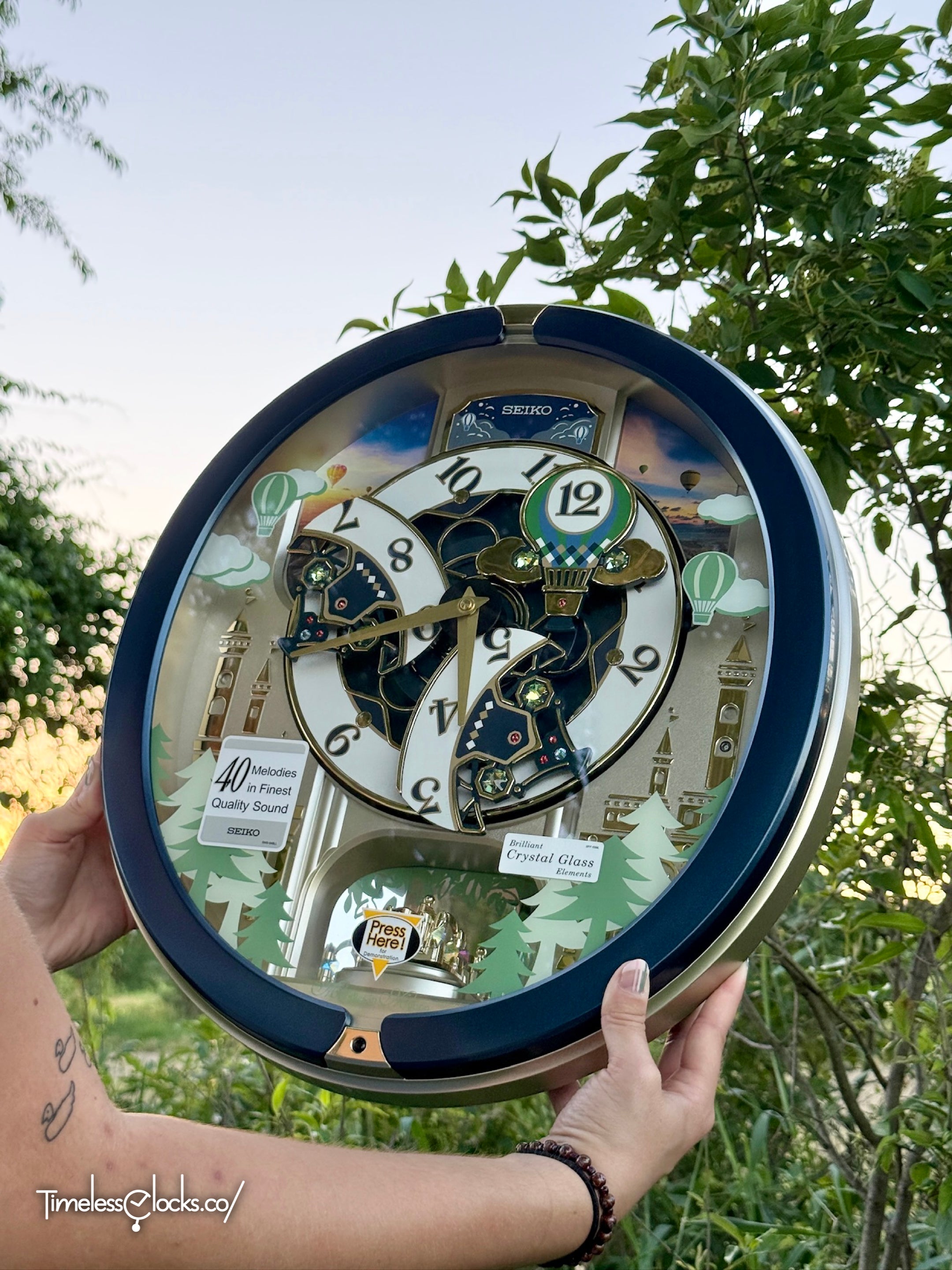Seiko QXM398LRH “Blue Pine Fantasy” Melodies in Motion Dancing Dial Musical Wall Clock with 40 Songs