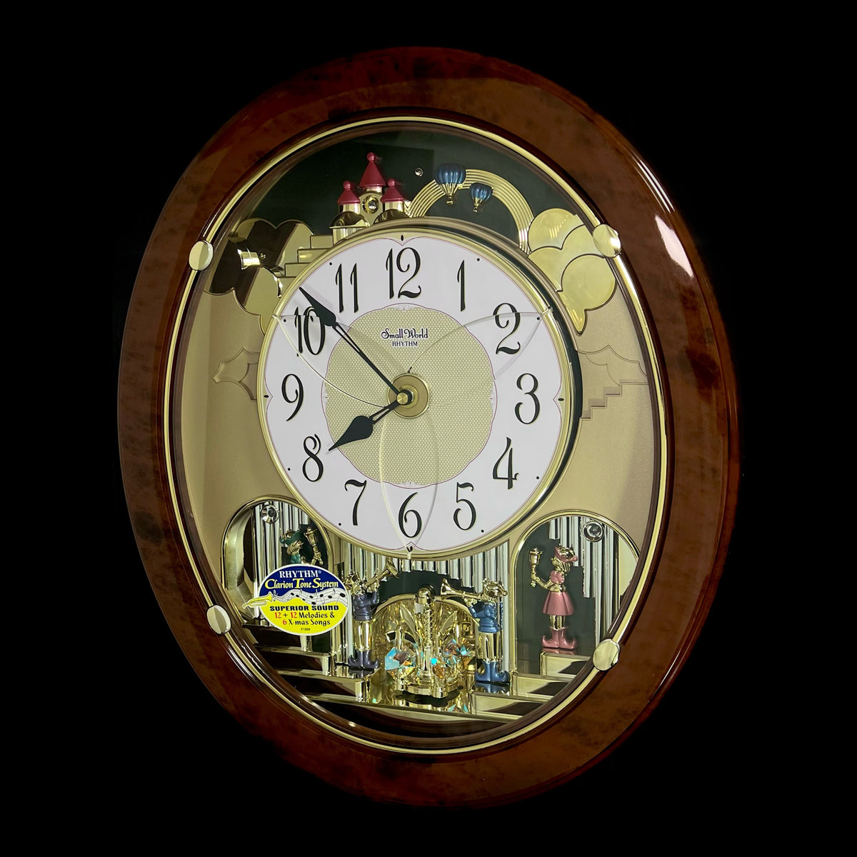 Rhythm "Woodgrain Stars" Moving Dial Magic Motion Musical Wall Clock - 4MH843WS23