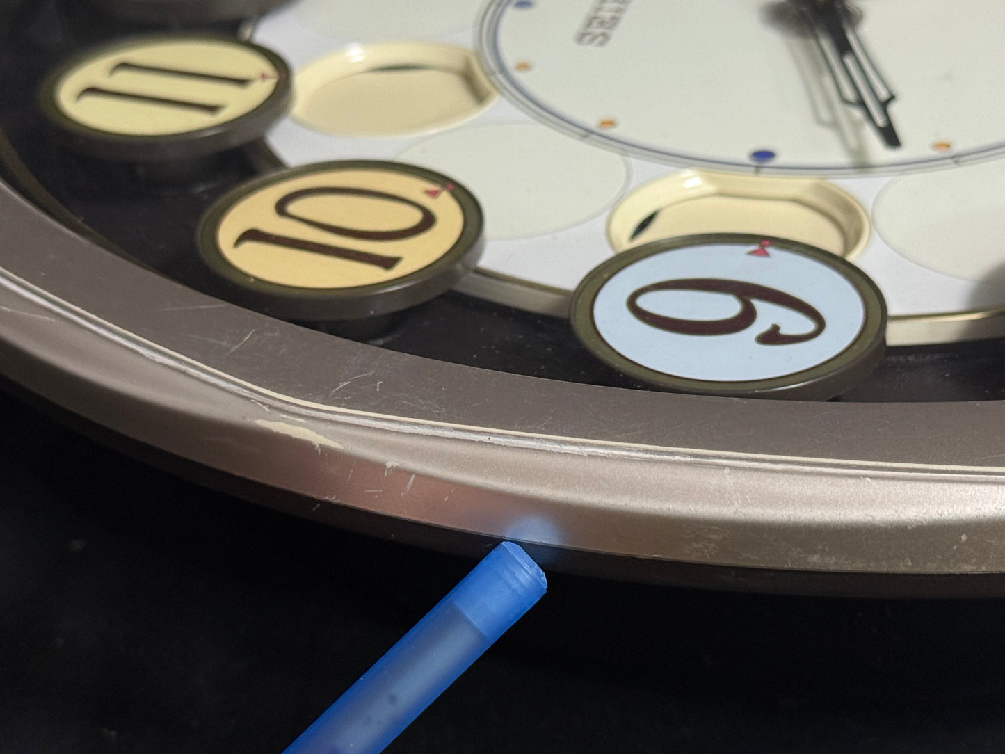 Seiko QXM106SRH "Twirling Numbers" Melodies in Motion Musical Wall Clock with Moving Dial