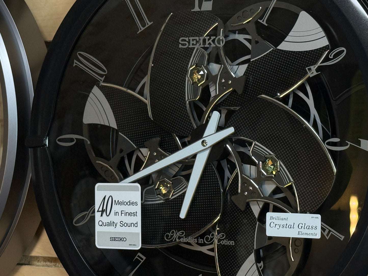 Seiko QXM621KRH “Onyx” Melodies in Motion Dancing Dial Musical Wall Clock with 40 Songs