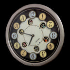 Seiko QXM106SRH "Twirling Numbers" Melodies in Motion Musical Wall Clock with Moving Dial