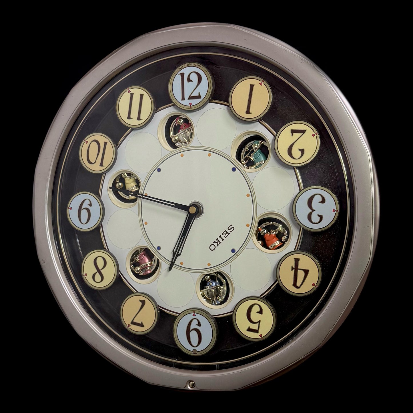 Seiko QXM106SRH "Twirling Numbers" Melodies in Motion Musical Wall Clock with Moving Dial