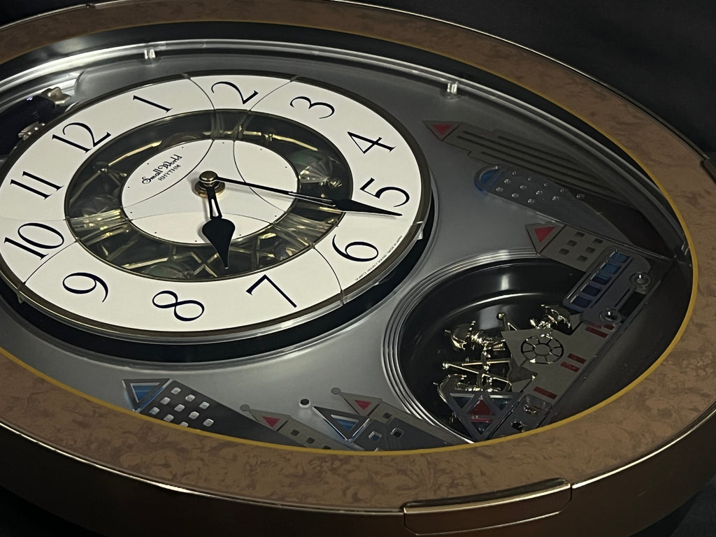 Rhythm “Tri-Cracker” Moving Dial Magic Motion Musical Wall Clock with Popular Melodies - 4MH759NR06