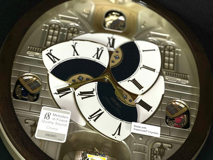 Seiko QXM371BRH “Castle Windows” Melodies in Motion Dancing Dial Musical Wall Clock