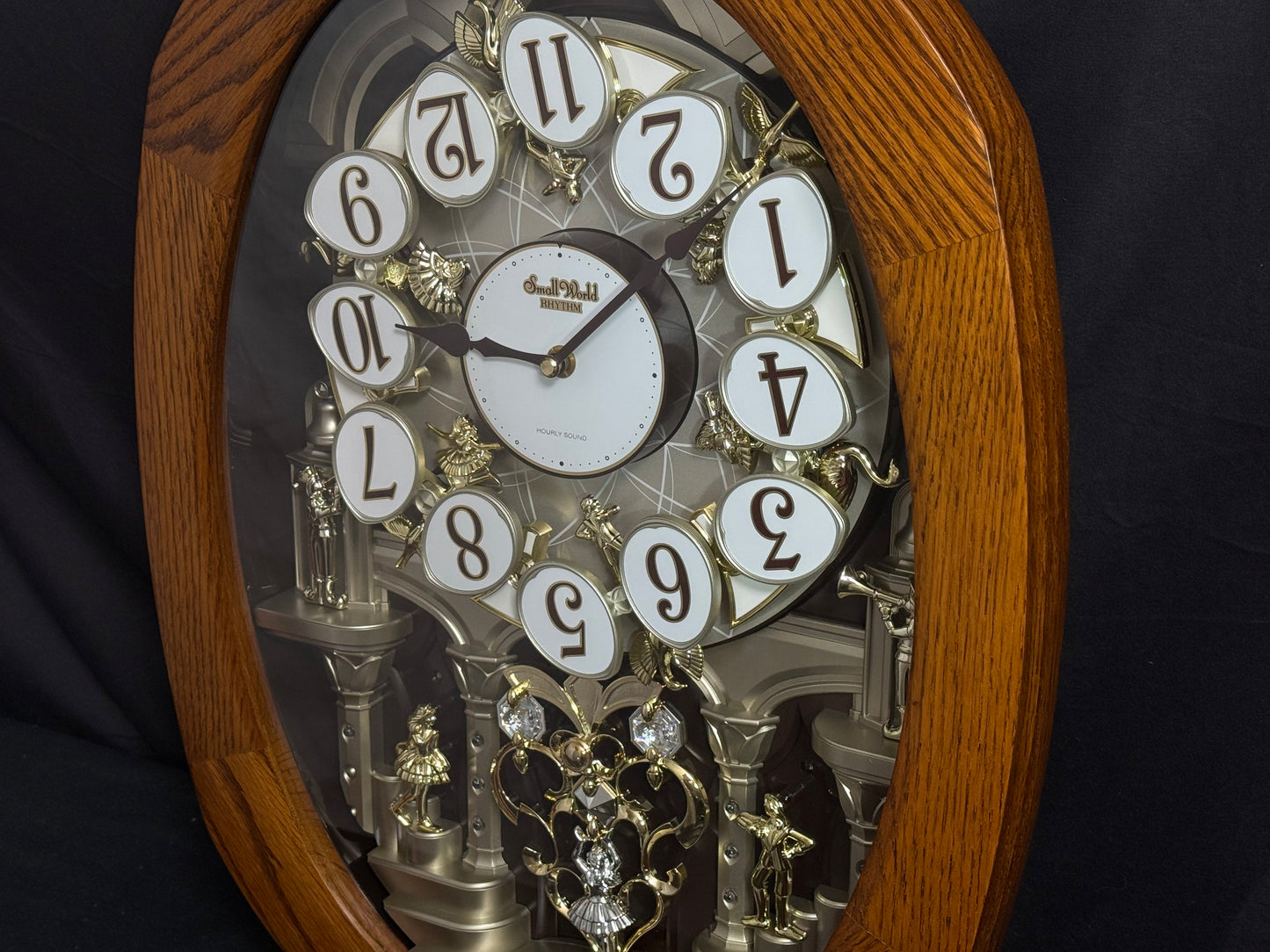 Rhythm "SSS Encore" Magic Motion Musical Wooden Wall Clock with Animated Moving Dial and Popular Melodies - 4MH810-R06