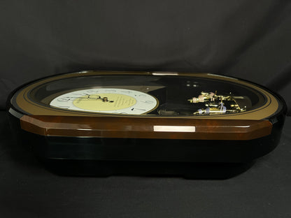 Seiko QXM124GRH "Music Disc Figurines" Melodies in Motion Musical Moving Wall Clock with Popular Music