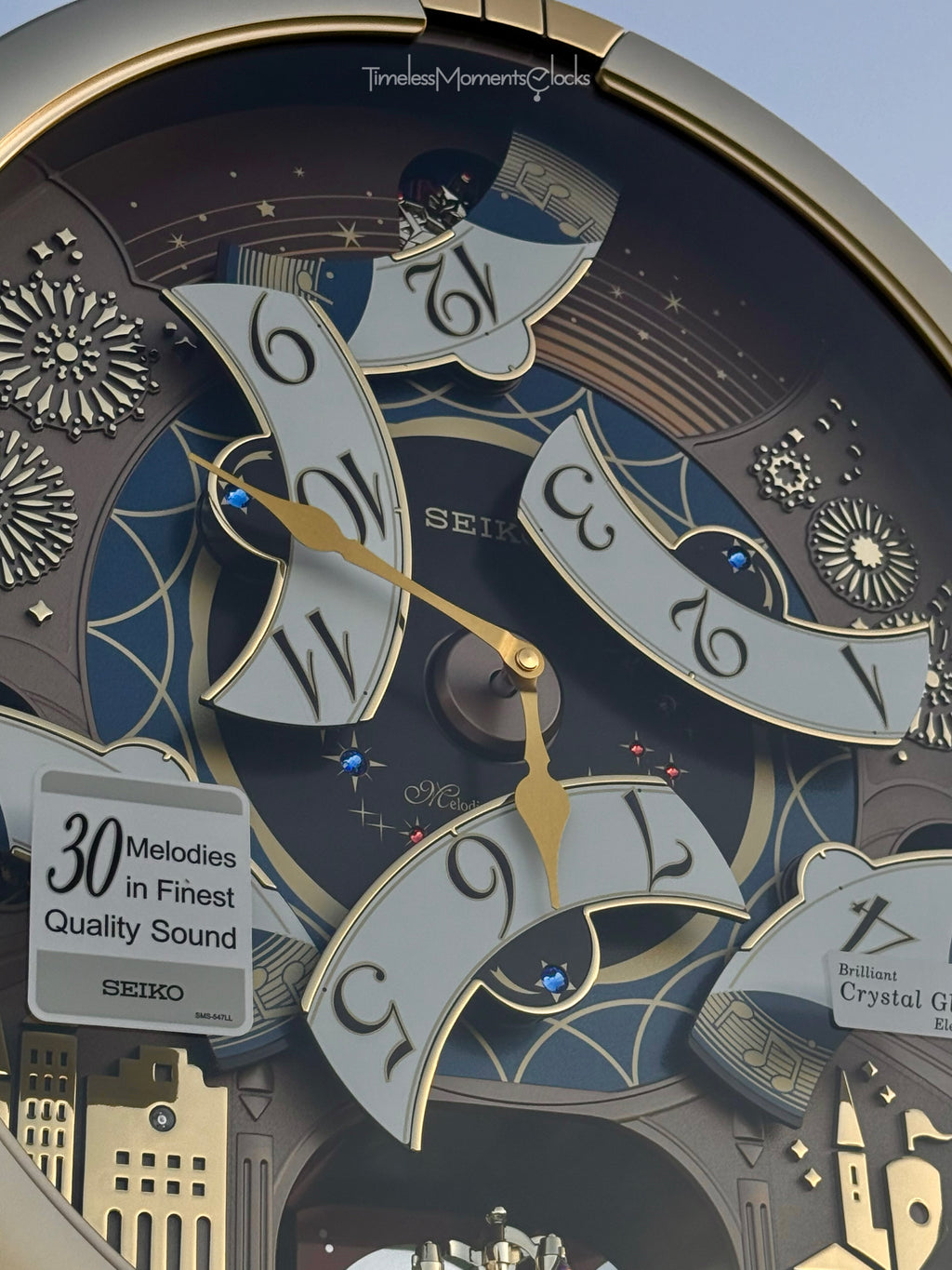 Seiko QXM620GRH "Golden Festival" Melodies in Motion Dancing Dial Musical Wall Clock with 30 Songs