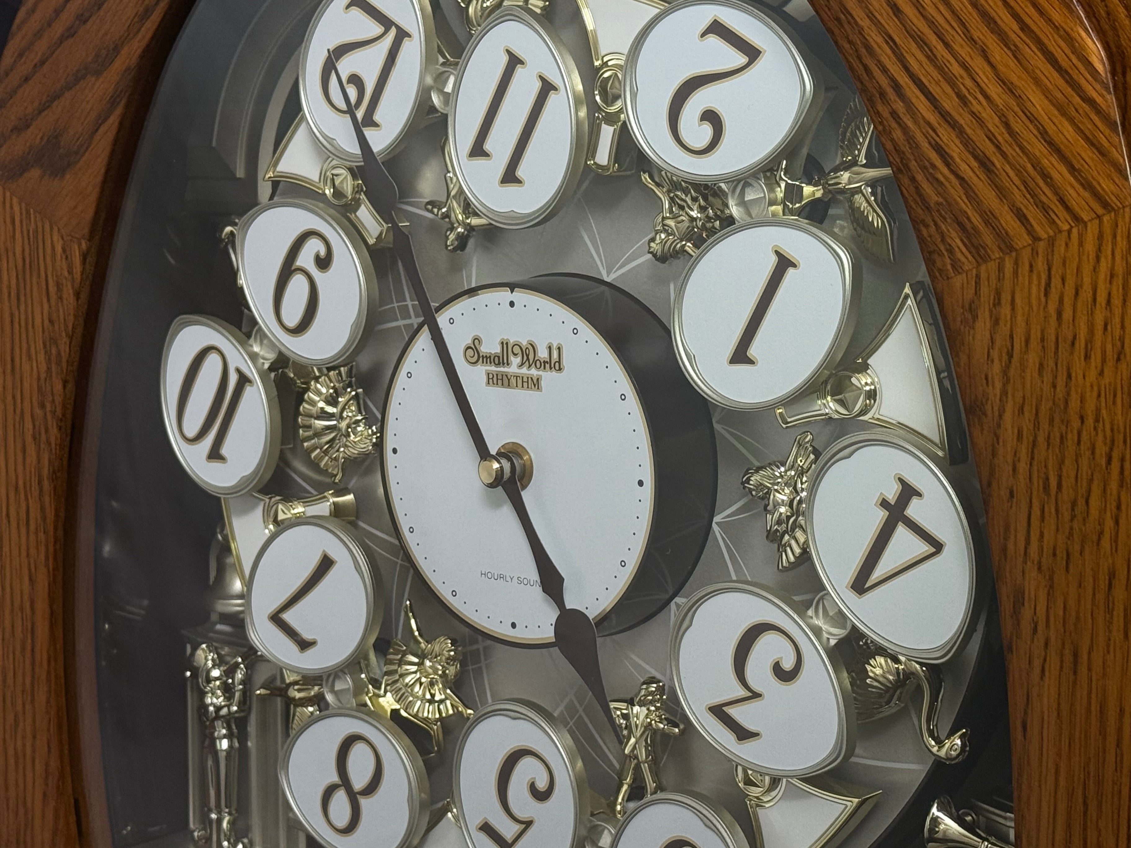 Rhythm "SSS Encore" Magic Motion Musical Wooden Wall Clock with Animated Moving Dial and Popular Melodies - 4MH810-R06