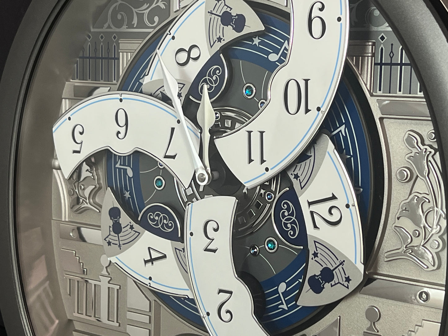 Seiko QXM366SRH “Musical Motifs” Melodies in Motion Dancing Dial Musical Wall Clock