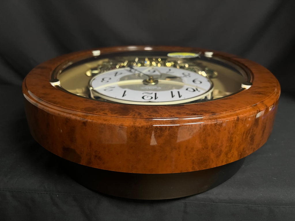 Rhythm "Woodgrain Stars" Moving Dial Magic Motion Musical Wall Clock - 4MH843WS23