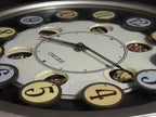 Seiko QXM106SRH "Twirling Numbers" Melodies in Motion Musical Wall Clock with Moving Dial