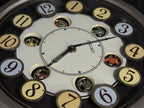 Seiko QXM106SRH "Twirling Numbers" Melodies in Motion Musical Wall Clock with Moving Dial