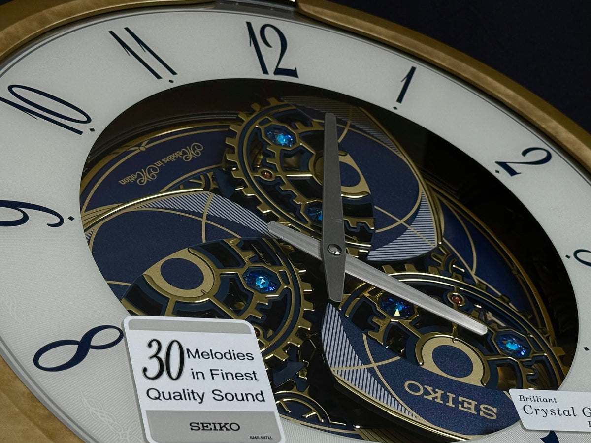 Seiko QXM387GRH “Kingly Mechanical” Melodies in Motion Dancing Dial Musical Wall Clock with 30 Songs