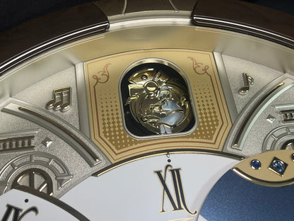 Seiko QXM371BRH “Castle Windows” Melodies in Motion Dancing Dial Musical Wall Clock