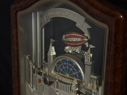 Seiko QXM135BRH "Lover’s Castle" Melodies in Motion Musical Moving Wall Clock with Popular Melodies