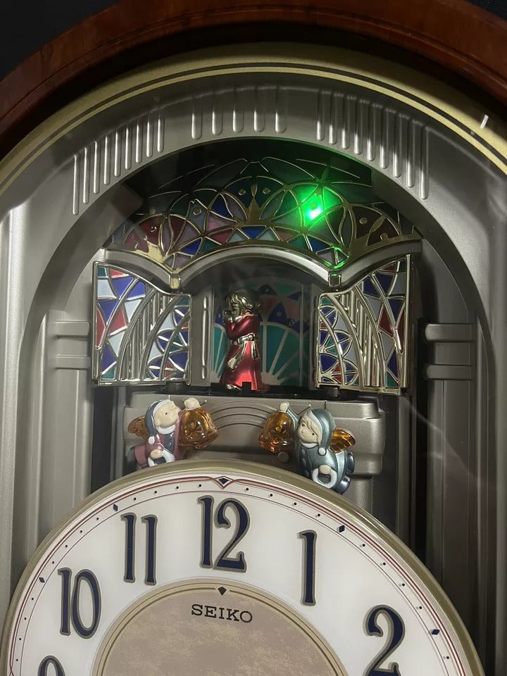 Seiko QXM123BRH "Broadway Showtunes Dropping Dial" Melodies in Motion Musical Moving Wall Clock with Popular Melodies