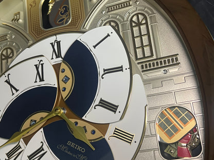 Seiko QXM371BRH “Castle Windows” Melodies in Motion Dancing Dial Musical Wall Clock