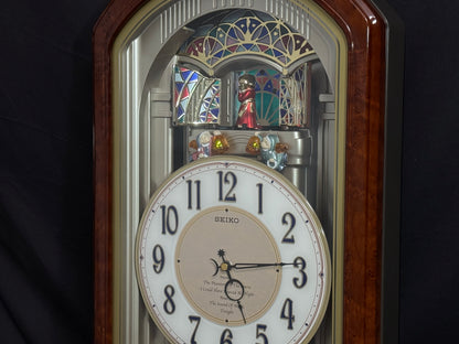 Seiko QXM123BRH "Broadway Showtunes Dropping Dial" Melodies in Motion Musical Moving Wall Clock with Popular Melodies