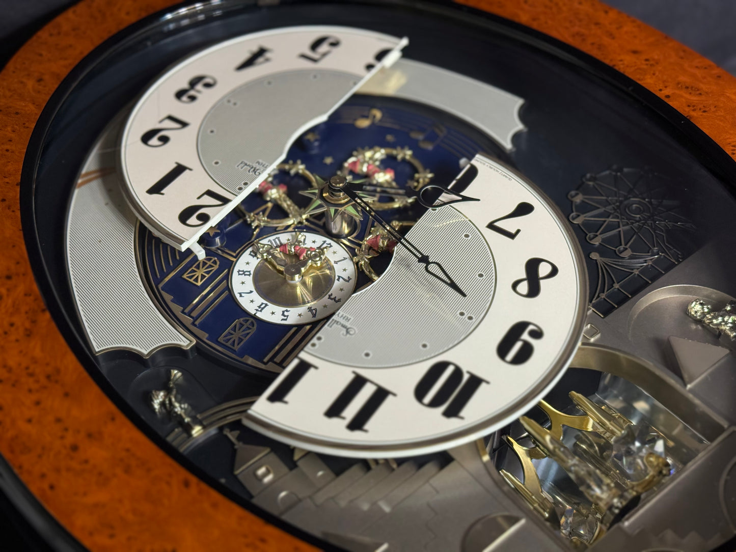 Rhythm “DWS Timecracker” Moving Dial Magic Motion Musical Wooden Wall Clock with Popular Melodies - 4MH752-R06