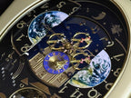 Rhythm “Peaceful Cosmos Entertainer” Moving Earth Dial Magic Motion Musical Wall Clock with Popular Melodies - 4MH839WB19