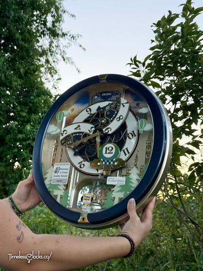 Seiko QXM398LRH “Blue Pine Fantasy” Melodies in Motion Dancing Dial Musical Wall Clock with 40 Songs