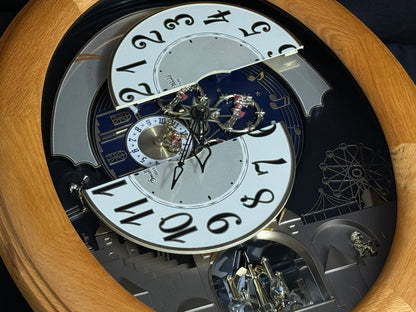 Rhythm "Timecracker Golden Oak" Moving Dial Magic Motion Musical Wooden Wall Clock with Popular Melodies - 4MH782-R07