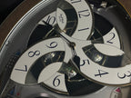Rhythm “Tri-Cracker” Moving Dial Magic Motion Musical Wall Clock with Popular Melodies - 4MH759NR06