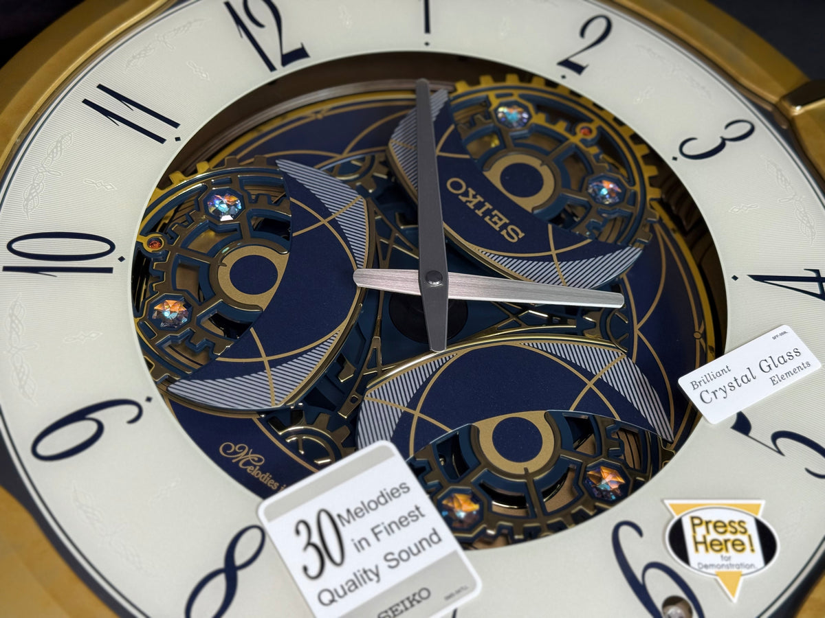 Seiko QXM387GRH “Kingly Mechanical” Melodies in Motion Dancing Dial Musical Wall Clock with 30 Songs