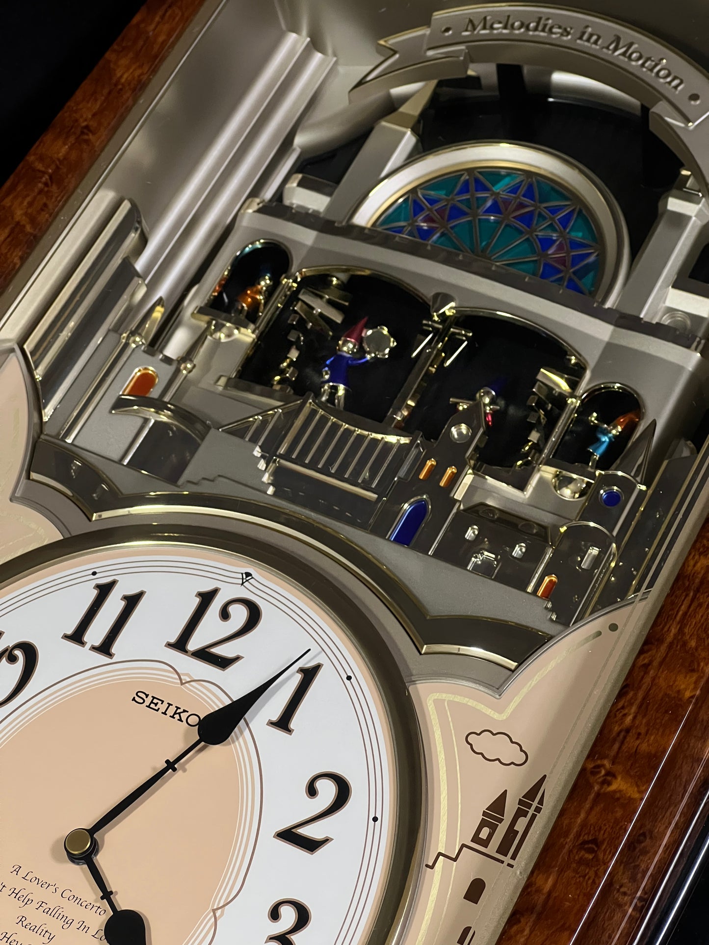 Seiko QXM135BRH "Lover’s Castle" Melodies in Motion Musical Moving Wall Clock with Popular Melodies