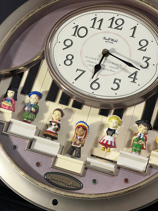 Rhythm “Jumping Kids” Magic Motion Musical Wall Clock with Moving Figurines and Piano Keys - 4MH721RH18