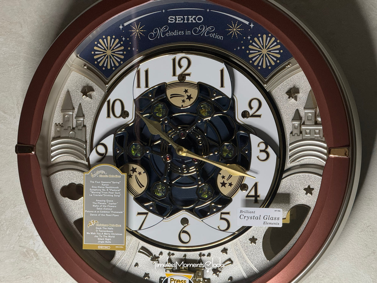 Seiko QXM378BRH “Castle Night” Melodies in Motion Dancing Dial Musical Wall Clock with 18 Songs